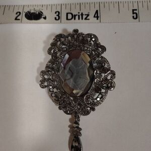 Vintage-Inspired Silver Brooch with Cameo Design